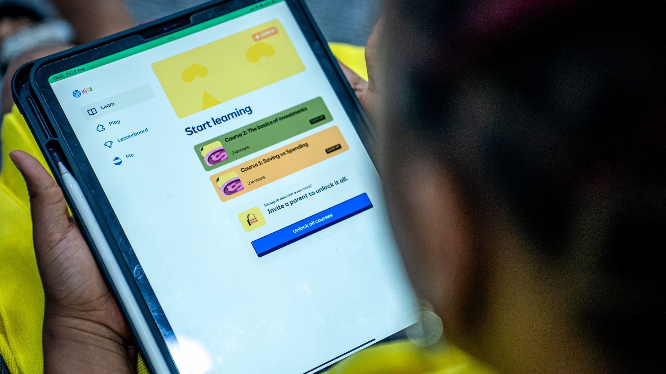 Student interacting with Cowrywise Kids - the financial app for kids